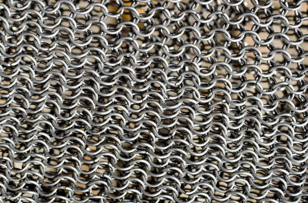 Texture of chainmail. Metallic texture, macro background.