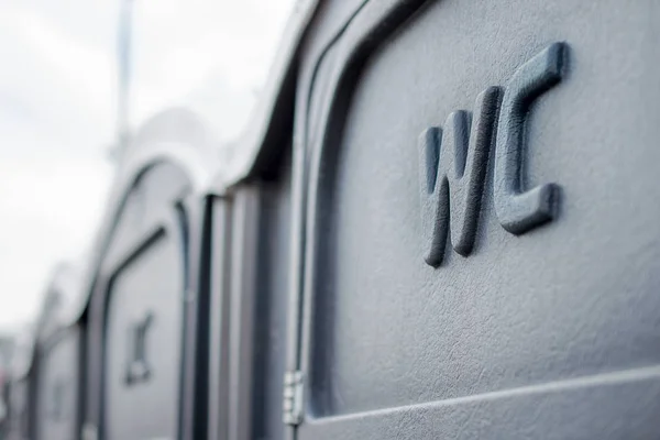 Street portable toilets in a row. Selective focus. — Stock Photo, Image