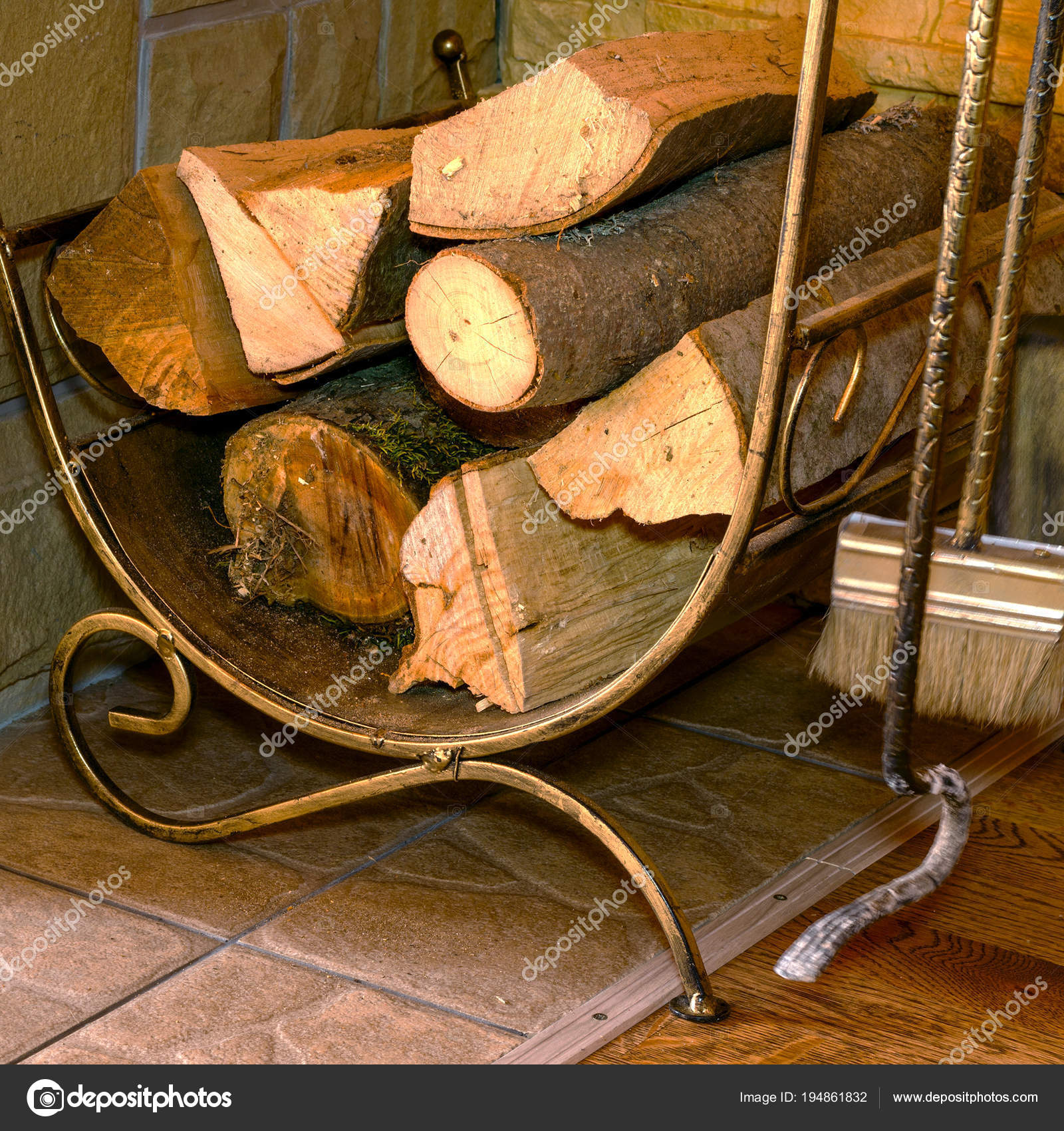 Stack Of Dry Firewood And Fireplace Accessories Stand Near Hous