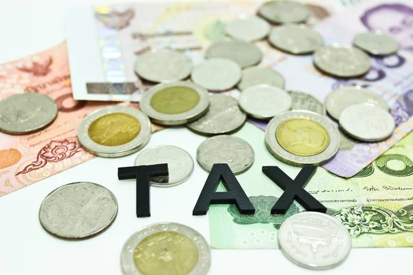 Thai Banknote and Coins with the Word TAX on the White Backgroun — Stock Photo, Image