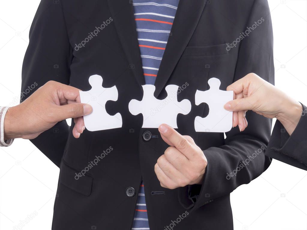 Teamwork business people assembling jigsaw puzzle 1