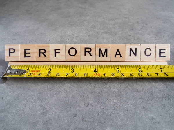 Word spell Performance on bare cement 1 — Stock Photo, Image