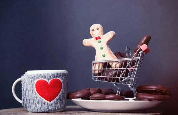 Cart and cup of tea with cookie