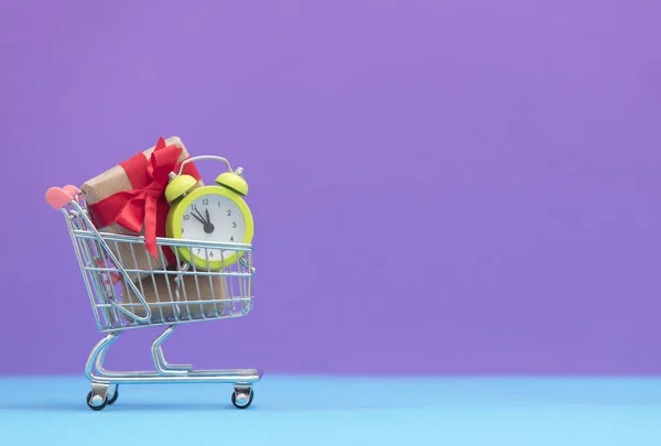 Gift boxes and alarm clock — Stock Photo, Image