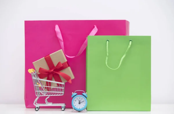 Shopping bags and shopping cart — Stock Photo, Image