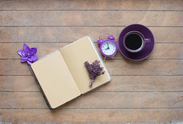 notebook with lavender and cup of coffee