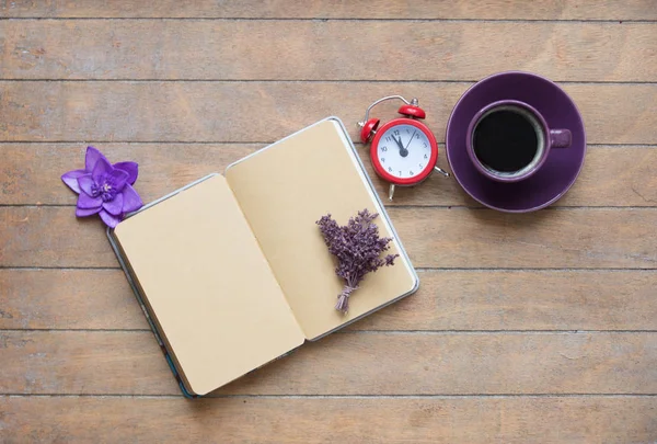 notebook with lavender and cup of coffee