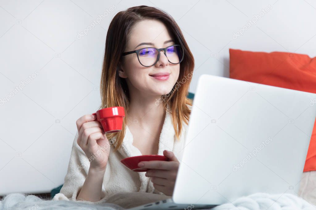 woman in cup of coffee in bed