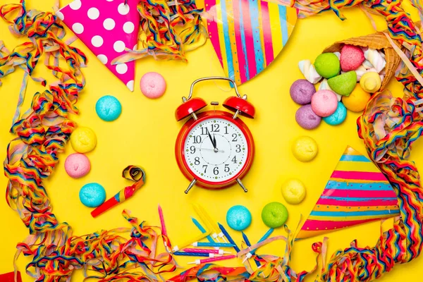 Alarm clock and birthday party objects — Stock Photo, Image