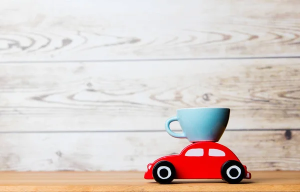 Toy car and tea cup — Stock Photo, Image