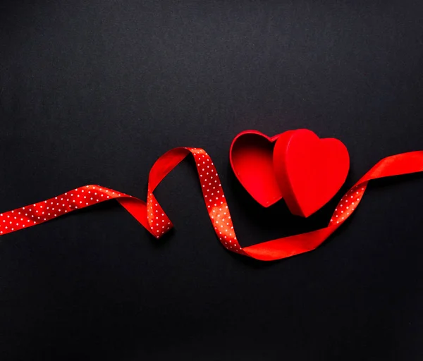 Photo of red hearts with ribbon — Stock Photo, Image