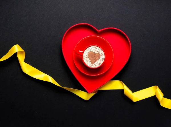 Red heart with yellow ribbon — Stock Photo, Image