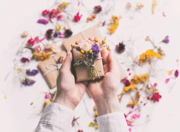 Female hands holding gift box — Stock Photo, Image