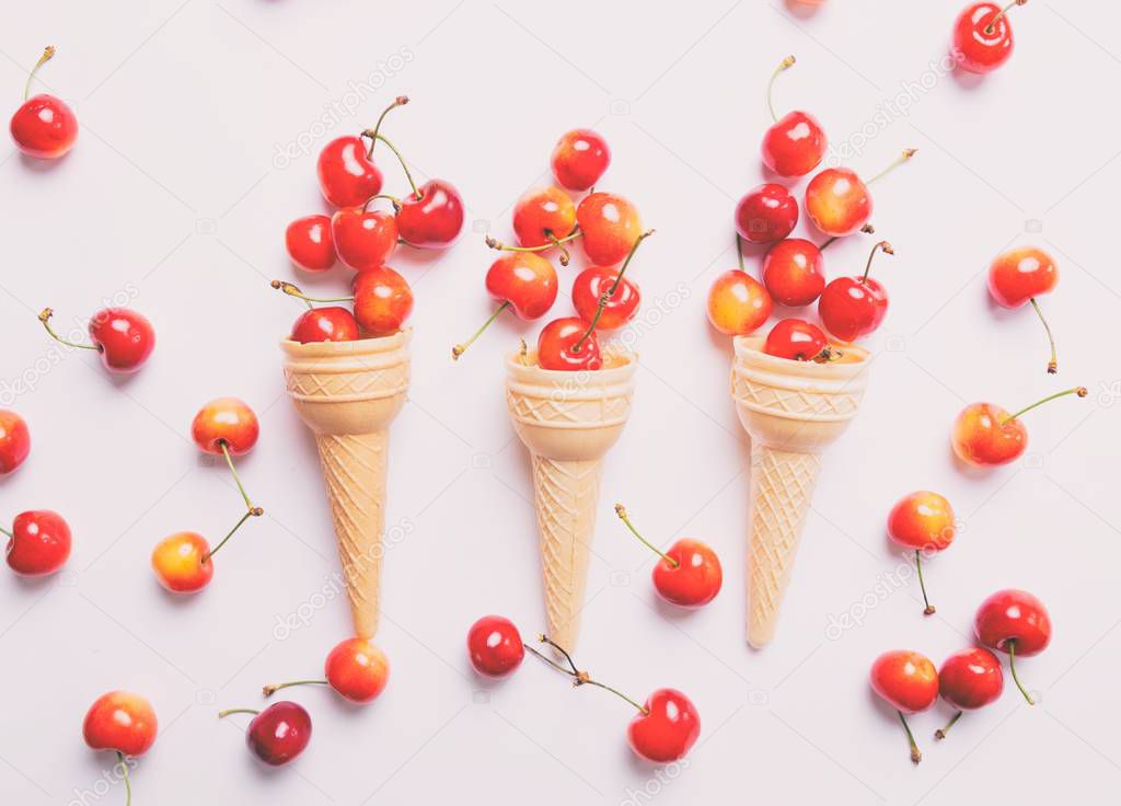 Cherries and three ice-cream cones