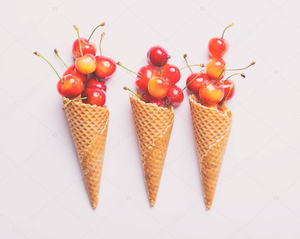 Cherries and three ice-cream cones