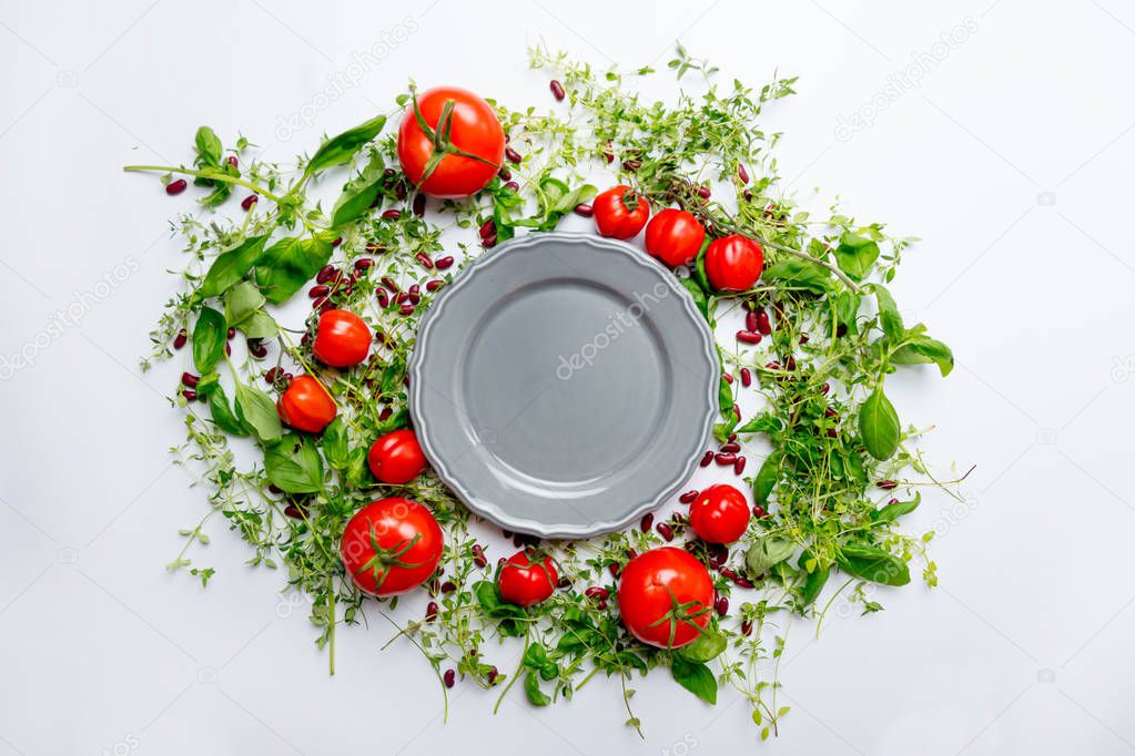 herbs and tomatoes and plate 