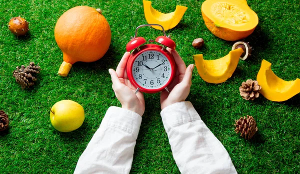 Female hands holding alarm clock — Stock Photo, Image