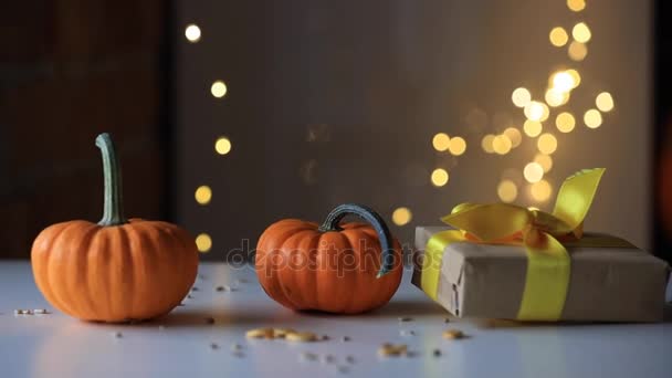 Two pumpkins and gift box — Stock Video