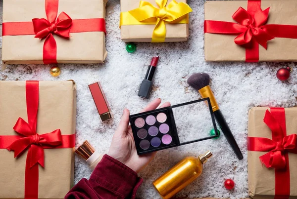 Female hands holding eye shadow palette — Stock Photo, Image