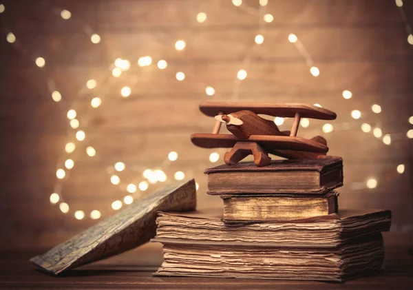 Vintage books and wooden plane