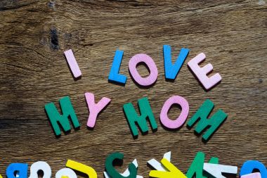 Mothers day concept - I Love My Mom texts on Wooden Background