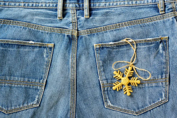 Gold snowflake christmas decoration in old grunge vintage denim — Stock Photo, Image