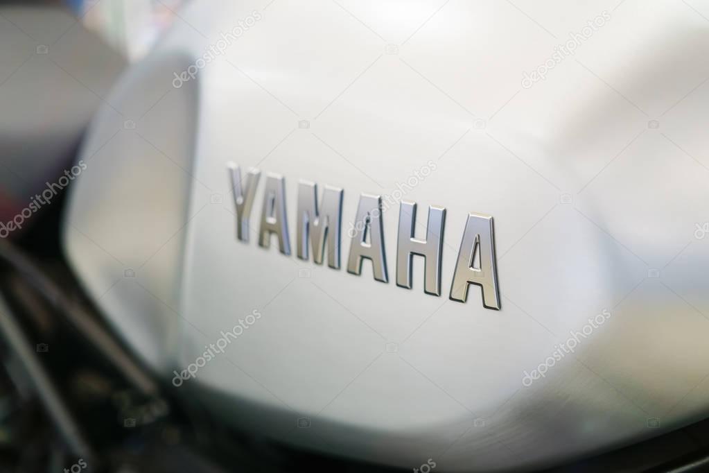 Bangkok, Thailand - November 14, 2017: Close up of YAMAHA logo on the motorcycle body. YAMAHA is one of the famous motorcycle manufacturers in the world. Yamaha Motor Company is a Japanese manufacturer of motorcycles, marine products such as boats an