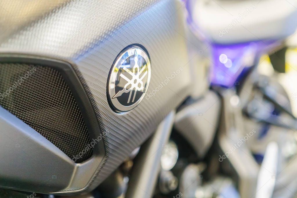 Bangkok, Thailand - November 14, 2017: Close up of YAMAHA logo on the motorcycle body. YAMAHA is one of the famous motorcycle manufacturers in the world. Yamaha Motor Company is a Japanese manufacturer of motorcycles, marine products such as boats an