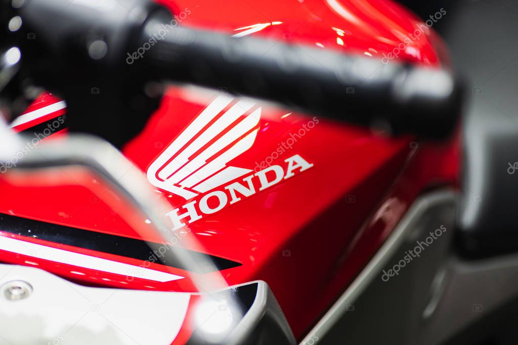 Bangkok, Thailand - Decemeber 5, 2019 : Honda  logo on the body of sports motorbike at a car show. Honda is a one of the famous manufacture of automobiles, motorcycles and power equipment.