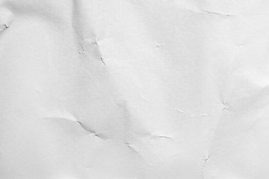 Crumpled and shabby empty white paper texture background.