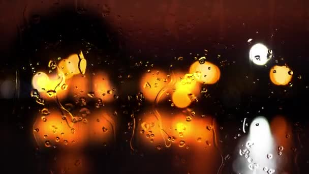Tetes Hujan Pada Kaca Dengan Lampu Bokeh Defocused Latar Belakang — Stok Video