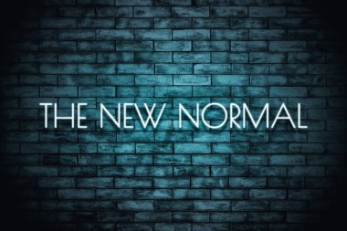 The New Normal. Neon light lettering  on brickwall background. New normal after covid-19 pandemic Background concept for poster, social network, banner, cards. clipart