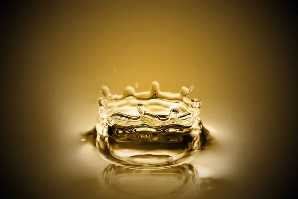 Beautiful Drops of liquid gold and ripple ,abstract background