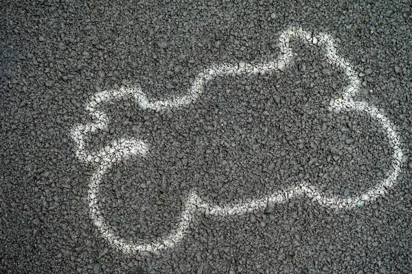 White outline of motorcycle at the accident on the Road