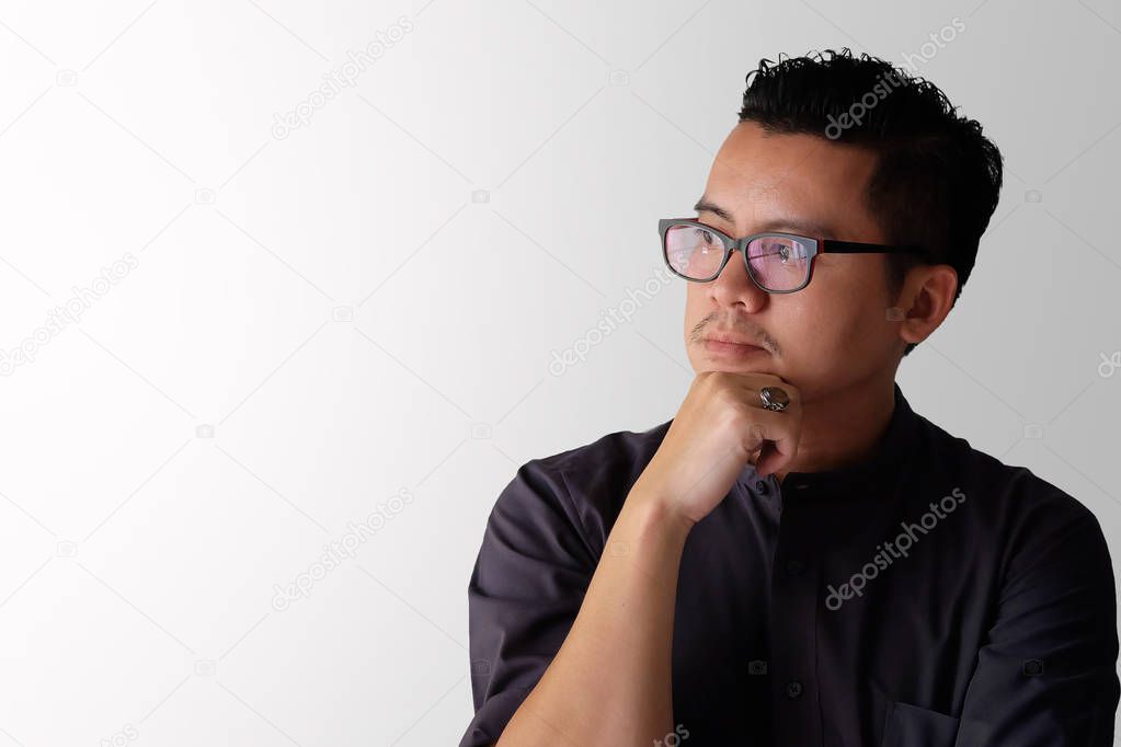 Asian men on white background looking out the window and some thoughtful.