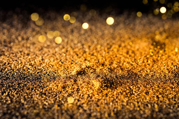 Sprinkle Złoty Błyszczący Pył Czarnym Tle Miejsca Kopiowania — Zdjęcie stockowe