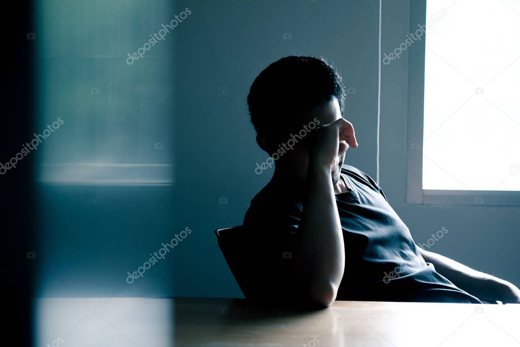 Asian men have stress Headache at the conference table in the meeting room