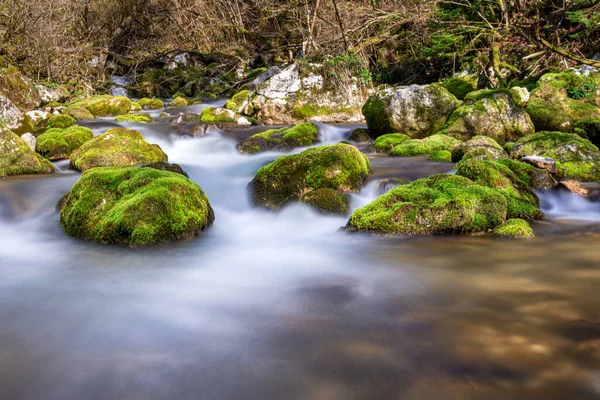 Long exposure photo, Cascading Waterfall with rocks, slow shutter photography, river stream
