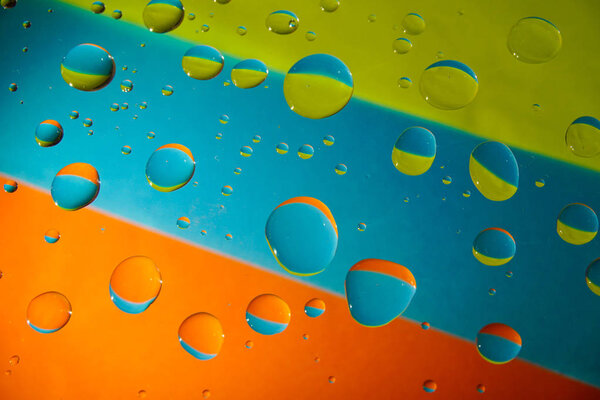 Water Drops On Colorful Background.