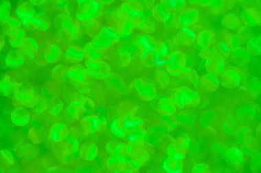 Bulanık parıltılı yeşil odaklanmış arkaplan