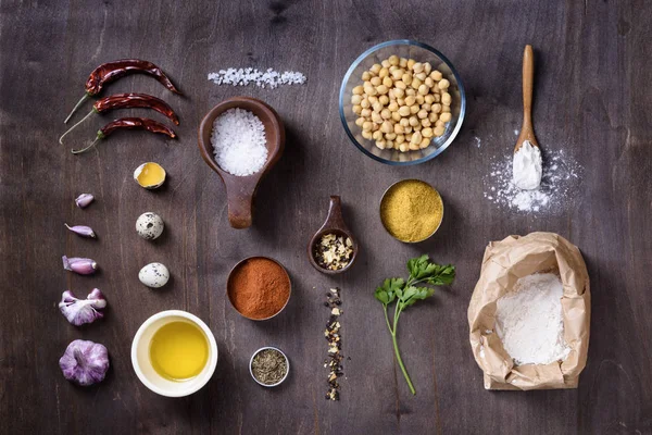 Raw cooking ingredients flat lay on wooden table. — Stock Photo, Image
