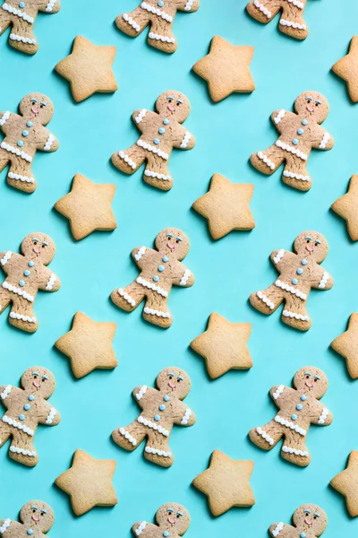 Bakery pattern. Stars and ginger man Christmas cookies on turquo