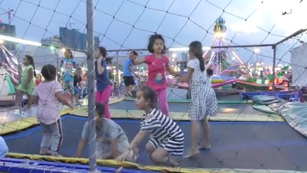 PHNOM PENH, CAMBODIA - MAY 21, 2017: Kids Jump in Slow Motion on Trampoline — Stock Video