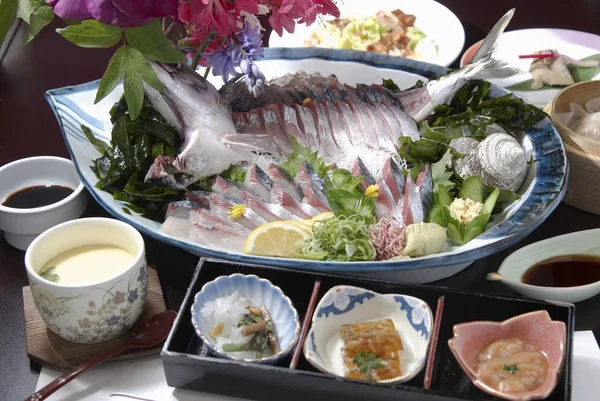 Delicious japanese fish on plate with spices — Stock Photo, Image