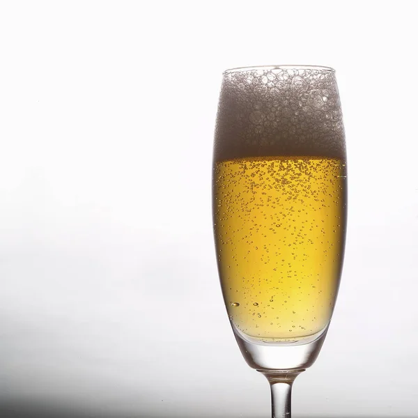 Bubbling Champagne in glass,