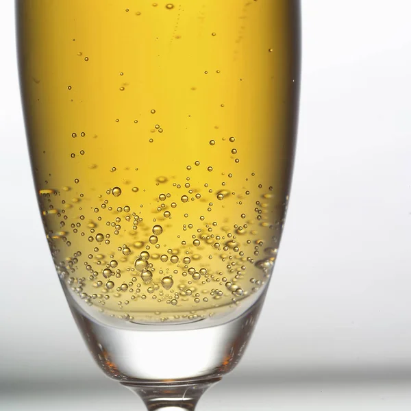 Bubbling Champagne in glass,