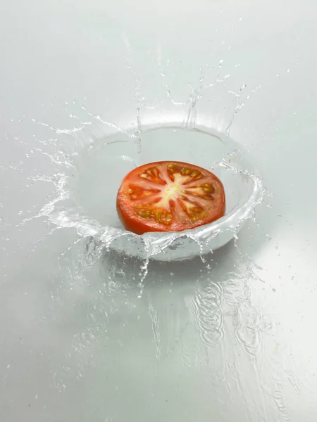 Fresh tomato in water — Stock Photo, Image