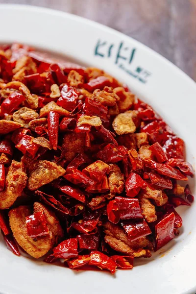 Sauteed chicken dices with chili peppers — Stock Photo, Image