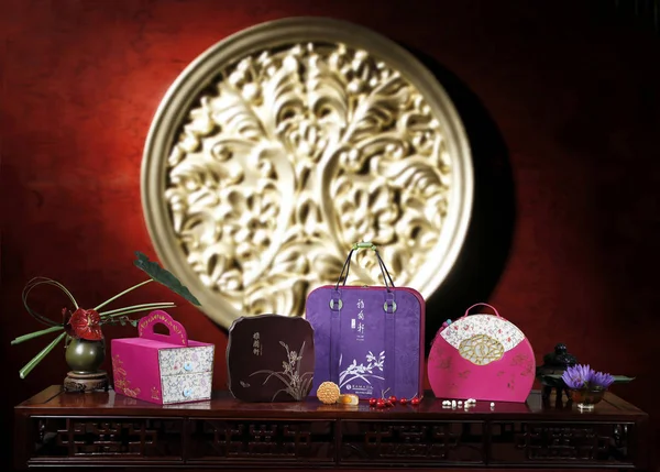 Colorful package with holiday moon cakes. Traditional Chinese pastry