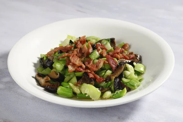 bacon with vegetables dish, close-up view